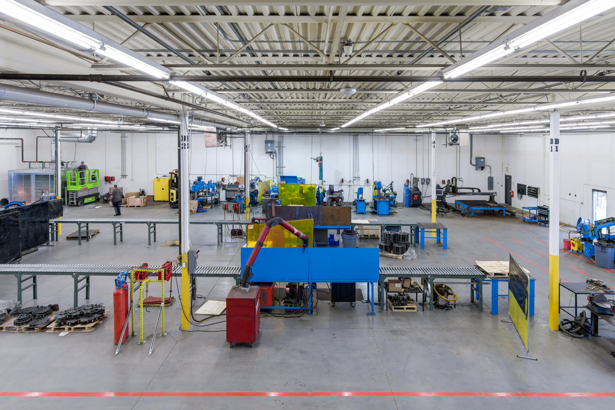 An industrial warehouse with red, yellow and blue accents